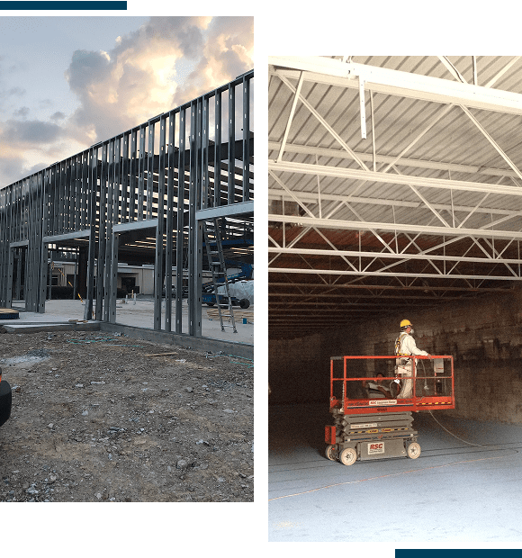 Construction site with steel framework and workers operating a lift inside a building.